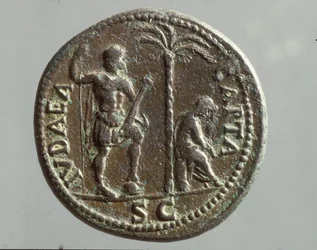 Imperiale Münze mit trauernden Figuren und der Inschrift 